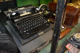 An old typewriter and a sewing machine.
