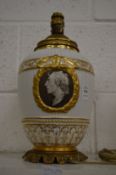 Continental porcelain and ormolu mounted lamp decorated with a portrait bust.