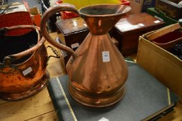 A copper harvest jug and copper coal scuttle.