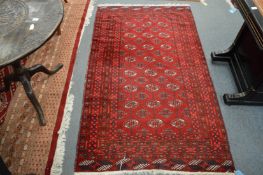 A bokhara rug, 182cm x 107cm.