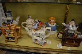 A collection of novelty teapots.