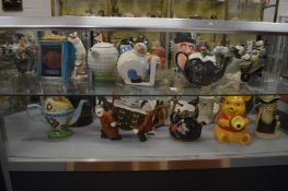 A collection of novelty teapots.