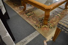 A beige ground Chinese carpet, 270cm x 181cm.