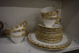 A small group of Crown Derby gilt decorated tea ware.