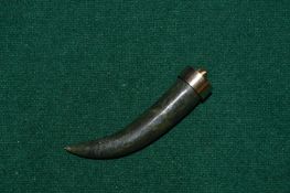 A natural jade tooth shaped pendant.