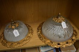 Two decorative ceiling lights.