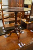 A George III mahogany circular tilt-top tripod table.