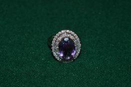 A silver and natural amethyst ring with certificate.