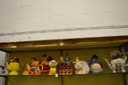 A collection of novelty teapots.