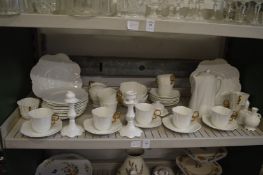 Quantity of Aynsley white porcelain tea ware with gilded handles.
