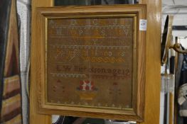A small framed and glazed sampler.