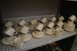 Earthenware cups and saucers.