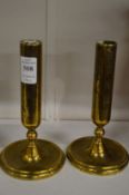 A pair of brass candlesticks.