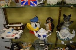 A collection of novelty teapots.