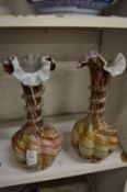 A pair of colourful glass vases.