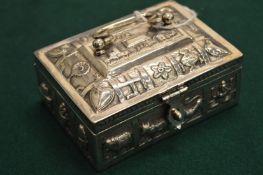 An Eastern white metal casket.