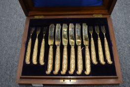 Mappin and Webb, a good cased set of twelve silver gilt dessert knives and forks.