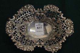 A pierced silver pedestal basket.