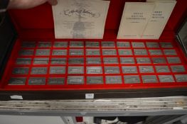 A cased set of pewter ingots commemorating Great British locomotives.