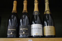 Two bottles of Drappier Premiere Cru Champagne and two other bottles of Champagne.