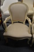 A French style cream painted and upholstered open armchair.