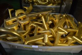 Quantity of gilded resin letters.