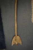 A wooden paddle.