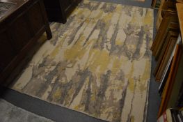 A contemporary rug of abstract design, 240cm x 170cm.