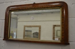A Victorian walnut framed over-mantel mirror.