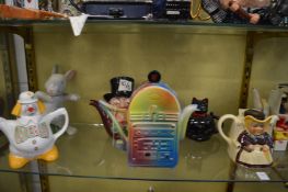 A collection of novelty teapots.