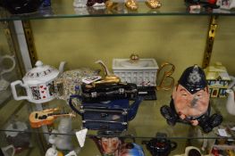 A collection of novelty teapots.