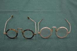 Two pairs of early spectacles.