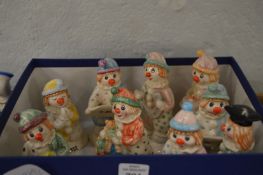 A collection of Beswick clowns.