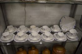 Shelley porcelain part tea service comprising, twelve cups, twelve saucers, eleven plates, milk