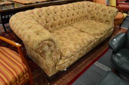 A 19th century Chesterfield settee, the reeded tapering square feet with brass castors.