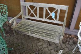 A hard wood garden bench.