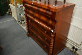 A large Victorian mahogany chest of drawers.