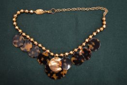 A decorative necklace, signed Babylone.