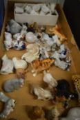 Miniature porcelain animals and thimbles.