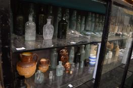 A good large collection of old bottles, stoneware jars etc.