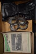 Old motoring goggles, gloves and Motor Sport Magazine.