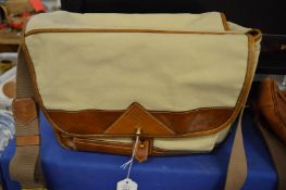 A canvas and leather trimmed camera bag.