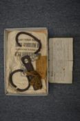 Slavery interest, wrought iron shackles together with a Baptism certificate for Harold John