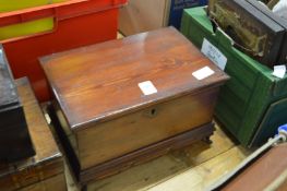 A miniature pine coffer.