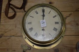 A brass ship style wall clock.