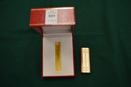 A Cartier lighter, boxed.