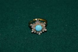 A decorative gilt metal ring set with natural turquoise and cz.