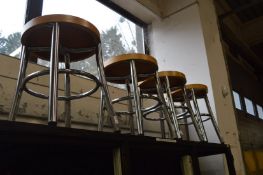 A set of four chrome framed stools.