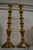 Large pair of brass candlesticks.