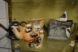 A collection of novelty teapots.